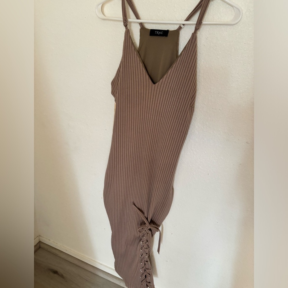 Trac dress with beautiful lacing on the leg.